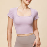 新しいシンプルな大きなラウンドネックスポーツヨガ半袖美しいバックメッシュ吸湿発散性Tシャツランニングフィットネストップ女性用