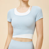 New Irregular Contrast Color Fake Two Piece Yoga Wear Short Sleeve Tight Fit Nude Fixed Cup Sports Running Fitness Wear T 