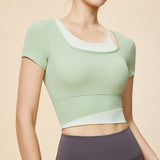New Irregular Contrast Color Fake Two Piece Yoga Wear Short Sleeve Tight Fit Nude Fixed Cup Sports Running Fitness Wear T 